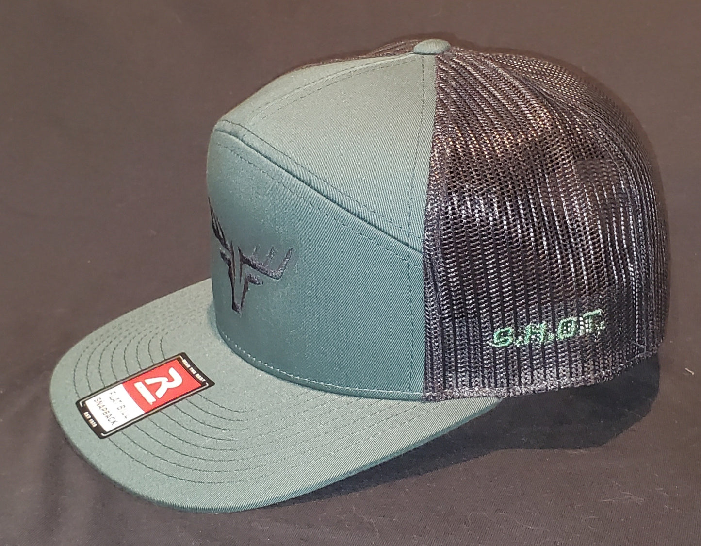 7 Panel Black & Green Richardson 168 with SHOT Buck Logo